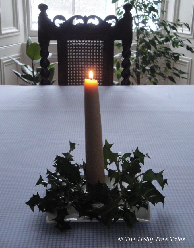 Beeswax, light &amp; holly sprigs