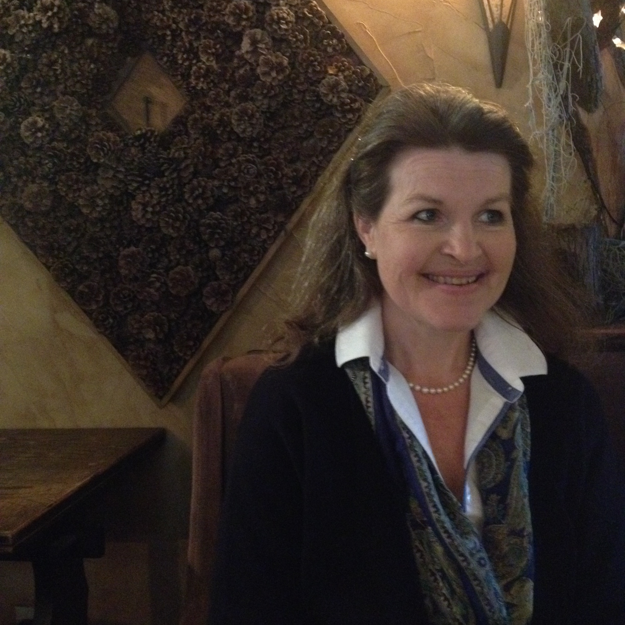 Woman. Smiling. Pearls.